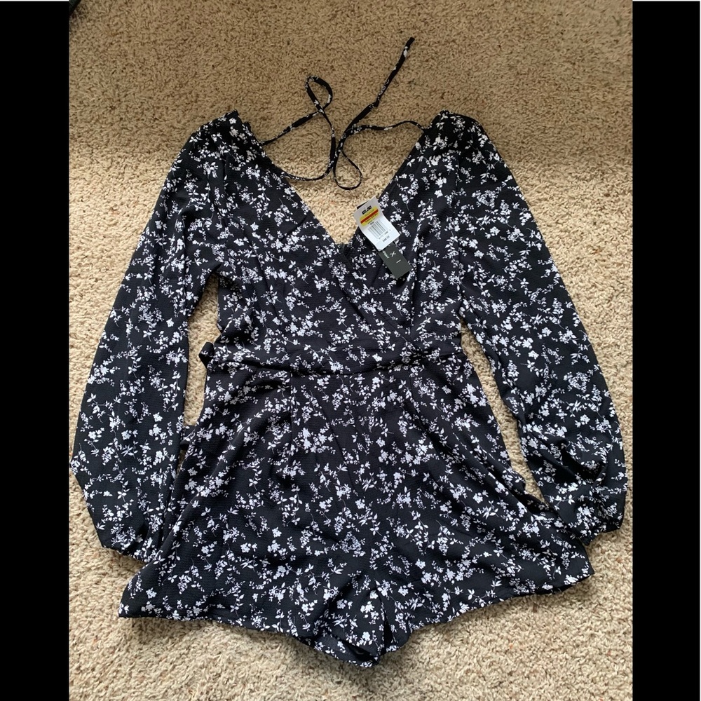 Kohl’s Trixx women’s black and white floral long-sleeved romper with tie waist